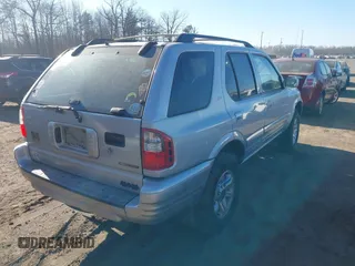 2002 Isuzu Rodeo z VIN 4S2DM58W524317574, wystawiony jako IAAI lot #41604546 z przebiegiem 150 000 mil mil oraz . Historia ofert i sprzedaży dostępna na DreamBid. Obrazek 4.
