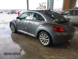 2018 Volkswagen Beetle S with VIN 3VWFD7AT6JM703758, listed as a IAAI auction lot 41381842 with 1 mi miles. Bid and sale history available at carsss.com. Image 3.