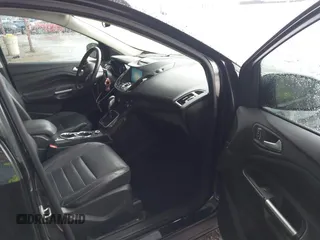 2014 Ford Escape Titanium z VIN 1FMCU0J96EUA84108, wystawiony jako IAAI lot #42114002 z przebiegiem 176 735 mil mil oraz . Historia ofert i sprzedaży dostępna na DreamBid. Obrazek 5.