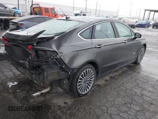2017 Ford Fusion Titanium with VIN 3FA6P0SU8HR329570, listed as a IAAI auction lot 41773023 with 112,022 mi miles and . Bid and sale history available at DreamBid. Image 4.