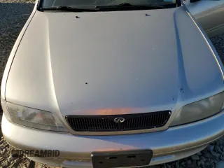 2002 Infiniti G20 Luxury z VIN JNKCP11A72T507242, wystawiony jako Copart lot #77325544 z przebiegiem 172 351 mil mil oraz Szkody całkowita. Historia ofert i sprzedaży dostępna na DreamBid. Obrazek 11.