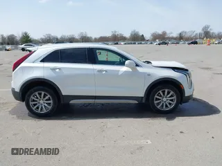 2020 Cadillac XT4 AWD Premium Luxury z VIN 1GYFZDR44LF036461, wystawiony jako IAAI lot #41934371 z przebiegiem 90 545 mil mil oraz . Historia ofert i sprzedaży dostępna na DreamBid. Obrazek 13.