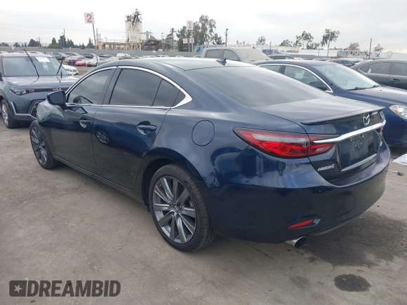 2018 Mazda 6 Grand Touring with VIN JM1GL1TY3J1334600, listed as a IAAI auction lot 41060893 with 64,852 mi miles and . Bid and sale history available at DreamBid. Image 3.