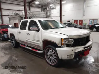 2009 Chevrolet Silverado 1500 LTZ with VIN 3GCEK33M39G177554, listed as a IAAI auction lot 41282566 with 142,356 mi miles and . Bid and sale history available at DreamBid. Image 1.