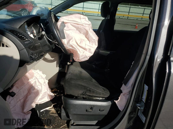 2015 Dodge Grand Caravan American Value with VIN 2C4RDGBG6FR603659, listed as a Copart auction lot 52385735 with 209,818 mi miles and Salvage Title. Bid and sale history available at DreamBid. Image 7.