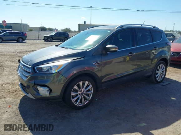 2018 Ford Escape Titanium with VIN 1FMCU0J99JUB09562, listed as a IAAI auction lot 41547659 with 63,700 mi miles and . Bid and sale history available at DreamBid. Image 2.