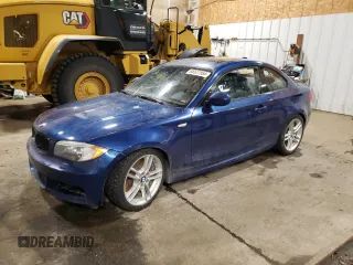 2011 BMW 1 Series 135i with VIN WBAUC9C50BVM11423, listed as a Copart auction lot 85527854 with 70,843 mi miles and Salvage title. Bid and sale history available at DreamBid. Image 1.