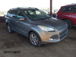 2014 Ford Escape SE with VIN 1FMCU9GX1EUA28135, listed as a IAAI auction lot 42617623 with 144,824 mi miles and . Bid and sale history available at DreamBid. Image 1.