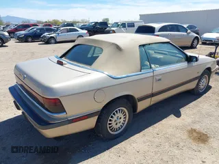 1992 Chrysler LeBaron z VIN 1C3XU4532NF283782, wystawiony jako IAAI lot #41841326 z przebiegiem 99 528 mil mil oraz . Historia ofert i sprzedaży dostępna na DreamBid. Obrazek 4.