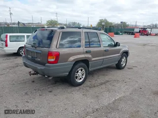 2002 Jeep Grand Cherokee Laredo with VIN 1J4GW48S32C123720, listed as a IAAI auction lot 41909204 with 157,996 mi miles. Bid and sale history available at carsss.com. Image 4.