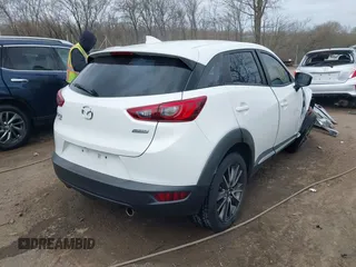 2016 Mazda CX-3 Grand Touring with VIN JM1DKFD73G0129737, listed as a IAAI auction lot 41875808 with 120,547 mi miles. Bid and sale history available at carsss.com. Image 4.