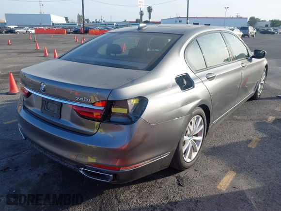2018 BMW 7 Series 740i with VIN WBA7E2C55JB214987, listed as a IAAI auction lot 41733790 with 96,738 mi miles. Bid and sale history available at carsss.com. Image 4.