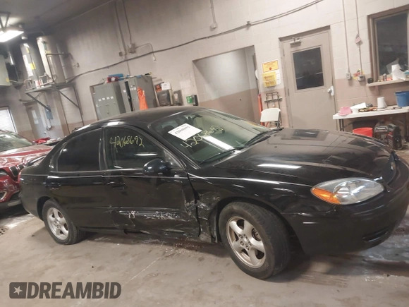 2004 Ford Taurus SE z VIN 1FAFP53U74G107504, wystawiony jako IAAI lot #42068692 z przebiegiem Nie podano mil oraz . Historia ofert i sprzedaży dostępna na DreamBid. Obrazek 13.