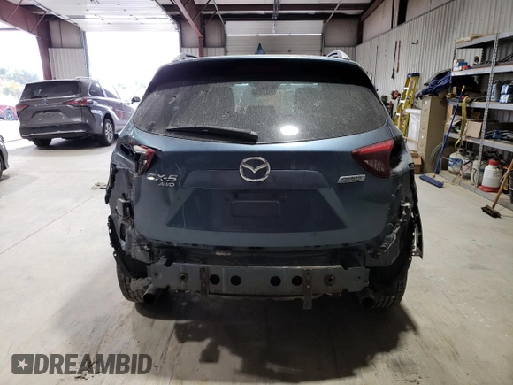 2016 Mazda CX-5 Grand Touring with VIN JM3KE4DY1G0714674, listed as a Copart auction lot 75516524 with 115,766 mi miles and Salvage Title. Bid and sale history available at carsss.com. Image 6.