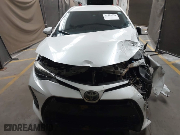 2017 Toyota Corolla L with VIN 5YFBURHE7HP693037, listed as a IAAI auction lot 42304020 with 117,710 mi miles and . Bid and sale history available at DreamBid. Image 13.