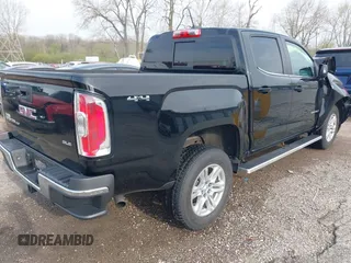 2019 GMC Canyon 4WD SLE z VIN 1GTG6CEN2K1354585, wystawiony jako IAAI lot #42014158 z przebiegiem 34 269 mil mil oraz . Historia ofert i sprzedaży dostępna na DreamBid. Obrazek 4.