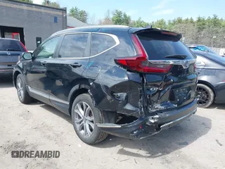 2020 Honda CR-V Touring with VIN 7FART6H96LE023782, listed as a IAAI auction lot 42053948 with 56,814 mi miles and . Bid and sale history available at DreamBid. Image 3.