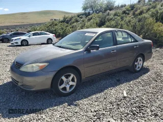 2002 Toyota Camry LE z VIN JTDBE32KX20020396, wystawiony jako Copart lot #59194485 z przebiegiem 203 861 mil mil oraz Czysty tytuł • Clean title. Historia ofert i sprzedaży dostępna na DreamBid. Obrazek 1.