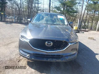 2020 Mazda CX-5 Grand Touring with VIN JM3KFBDM1L0821975, listed as a IAAI auction lot 40088794 with 68,895 mi miles and . Bid and sale history available at DreamBid. Image 13.
