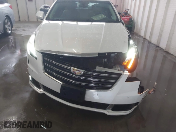 2018 Cadillac XTS Luxury z VIN 2G61M5S38J9156679, wystawiony jako IAAI lot #41574733 z przebiegiem 65 637 mil mil oraz . Historia ofert i sprzedaży dostępna na DreamBid. Obrazek 17.