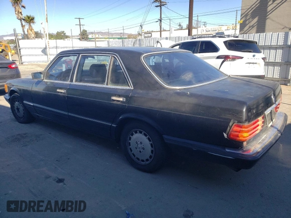 1989 Mercedes-Benz 560 with VIN WDBCA39E0KA446817, listed as a Copart auction lot 81615244 with 270,136 mi miles and Salvage Title. Bid and sale history available at DreamBid. Image 2.