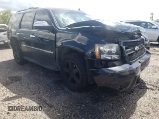 2009 Chevrolet Tahoe LTZ with VIN 1GNFK33039J125428, listed as a Copart auction lot 57962875 with 245,554 mi miles and Salvage title. Bid and sale history available at DreamBid. Image 4.