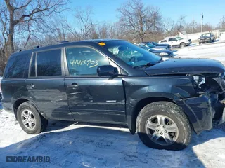 2004 Honda Pilot EX with VIN 2HKYF18544H574133, listed as a IAAI auction lot 41415703 with 217,539 mi miles. Bid and sale history available at carsss.com. Image 13.