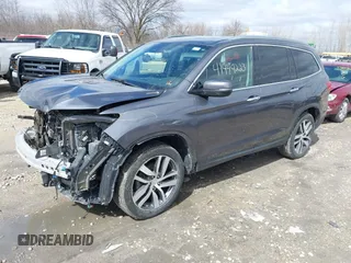 2017 Honda Pilot Touring with VIN 5FNYF6H92HB036406, listed as a IAAI auction lot 41949223 with 147,462 mi miles. Bid and sale history available at carsss.com. Image 2.
