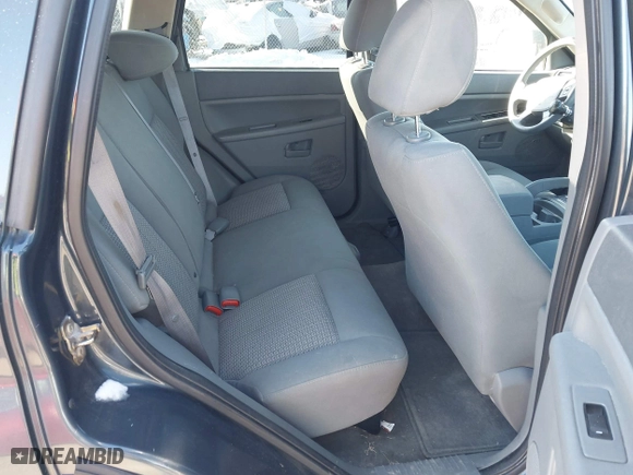 2007 Jeep Grand Cherokee Laredo with VIN 1J8GS48K97C538509, listed as a IAAI auction lot 41605236 with 164,530 mi miles. Bid and sale history available at carsss.com. Image 8.