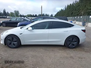 2020 Tesla Model 3 Standard Range Plus with VIN 5YJ3E1EA5LF613002, listed as a IAAI auction lot 42129085 with 55,672 mi miles. Bid and sale history available at carsss.com. Image 15.