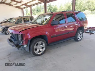 2007 Chevrolet Tahoe LS with VIN 1GNFC13C07R256584, listed as a IAAI auction lot 42678748 with 214,040 mi miles and . Bid and sale history available at DreamBid. Image 2.