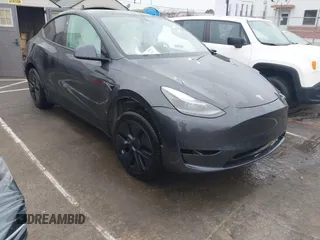 2025 Tesla Model Y Long Range with VIN 7SAYGDED8SA340082, listed as a IAAI auction lot 41915369 with 7,296 mi miles and . Bid and sale history available at carsss.com. Image 1.