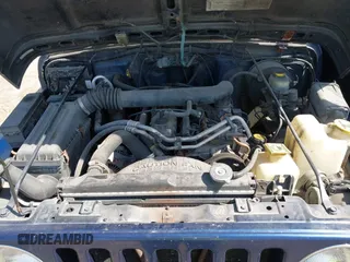 2000 Jeep Wrangler Sport with VIN 1J4FA49S7YP736479, listed as a IAAI auction lot 42042493 with 271,220 mi miles. Bid and sale history available at carsss.com. Image 10.