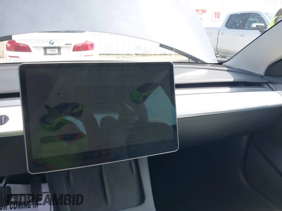 2023 Tesla Model 3 z VIN 5YJ3E1EAXPF414646, wystawiony jako IAAI lot #39514743 z przebiegiem 10 529 mil mil oraz . Historia ofert i sprzedaży dostępna na DreamBid. Obrazek 18.