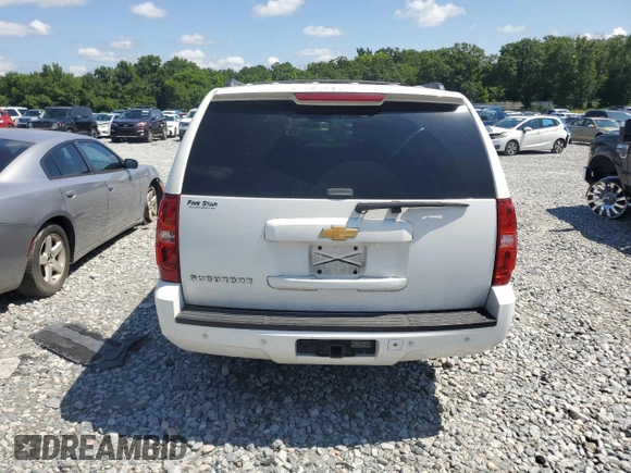 2013 Chevrolet Suburban LT with VIN 1GNSCJE0XDR146798, listed as a Copart auction lot 62408525 with 218,484 mi miles and Salvage title. Bid and sale history available at DreamBid. Image 6.