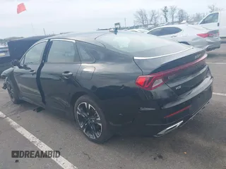 2024 Kia K5 GT-Line z VIN 5XXG64J22RG257080, wystawiony jako IAAI lot #42026127 z przebiegiem 19 477 mil mil oraz . Historia ofert i sprzedaży dostępna na DreamBid. Obrazek 3.