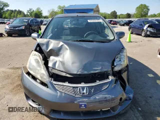 2011 Honda Fit Sport z VIN JHMGE8H5XBC002174, wystawiony jako Copart lot #52220125 z przebiegiem 161 816 mil mil oraz Szkody całkowita. Historia ofert i sprzedaży dostępna na DreamBid. Obrazek 5.