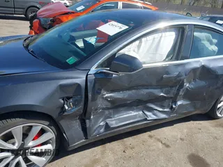 2018 Tesla Model 3 Long Range Battery with VIN 5YJ3E1EBXJF055203, listed as a IAAI auction lot 42019770 with 57,379 mi miles and . Bid and sale history available at DreamBid. Image 6.