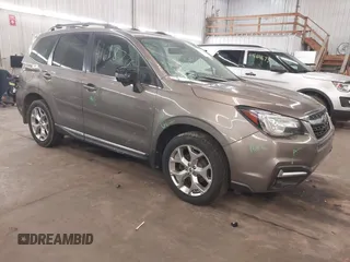 2017 Subaru Forester Touring z VIN JF2SJAWC1HH540937, wystawiony jako IAAI lot #41618776 z przebiegiem 131 239 mil mil oraz . Historia ofert i sprzedaży dostępna na DreamBid. Obrazek 1.