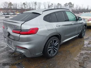 2021 BMW X4 M with VIN 5YMUJ0C01M9F26207, listed as a IAAI auction lot 41502307 with 31,995 mi miles. Bid and sale history available at carsss.com. Image 4.