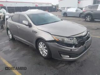 2014 Kia Optima EX z VIN 5XXGN4A75EG290132, wystawiony jako IAAI lot #41292706 z przebiegiem 155 793 mil mil oraz . Historia ofert i sprzedaży dostępna na DreamBid. Obrazek 1.
