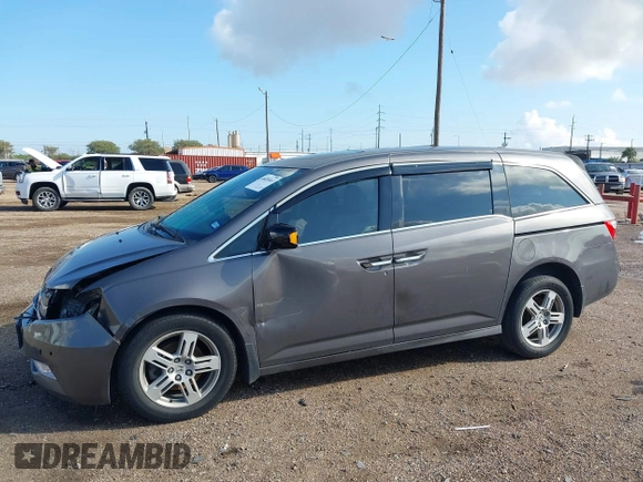 2011 Honda Odyssey Touring with VIN 5FNRL5H93BB104436, listed as a IAAI auction lot 40426003 with 93,342 mi miles and . Bid and sale history available at DreamBid. Image 14.