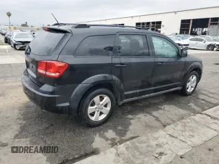 2013 Dodge Journey SE z VIN 3C4PDCAB7DT597063, wystawiony jako Copart lot #55896734 z przebiegiem 140 847 mil mil oraz Czysty tytuł • Clean title. Historia ofert i sprzedaży dostępna na DreamBid. Obrazek 3.