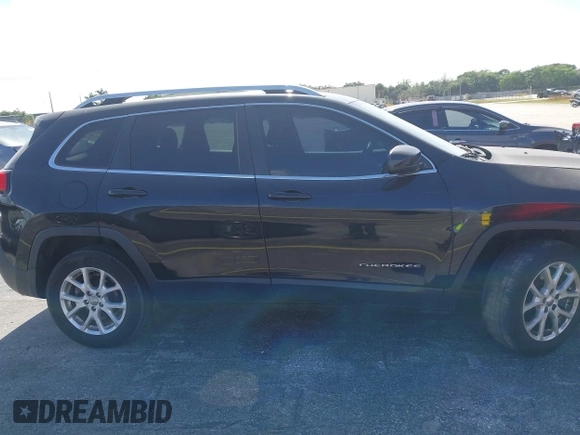 2015 Jeep Cherokee Latitude with VIN 1C4PJLCB4FW683904, listed as a IAAI auction lot 41579059 with 126,156 mi miles and . Bid and sale history available at carsss.com. Image 13.