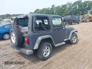 2001 Jeep Wrangler Sport with VIN 1J4FA49S91P330175, listed as a IAAI auction lot 40133432 with 999,999 mi miles. Bid and sale history available at carsss.com. Image 4.