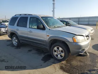 2002 Mazda Tribute LX with VIN 4F2YU09152KM50320, listed as a Copart auction lot 88131405 with 238,013 mi miles and Salvage Title. Bid and sale history available at carsss.com. Image 4.