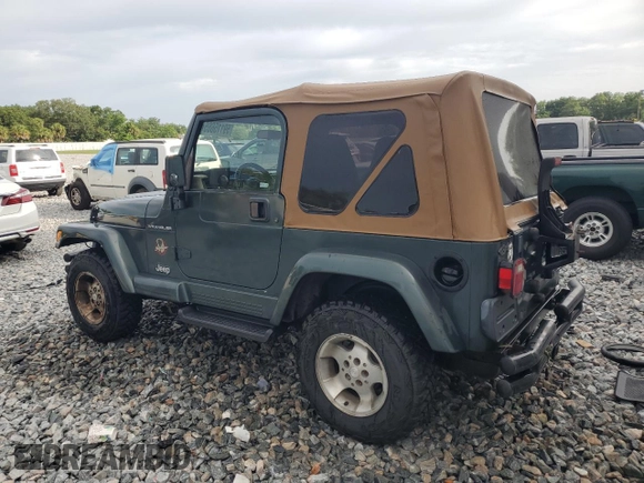 2002 Jeep Wrangler Sahara with VIN 1J4FA59S52P763290, listed as a Copart auction lot 59115665 with 129,479 mi miles and Non repairable. Bid and sale history available at DreamBid. Image 2.