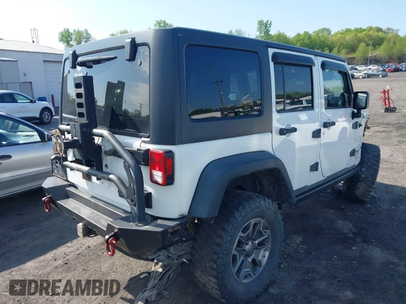 2014 Jeep Wrangler Unlimited Rubicon X with VIN 1C4BJWFG6EL240849, listed as a IAAI auction lot 42216082 with 118,912 mi miles and . Bid and sale history available at DreamBid. Image 4.
