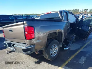 2014 Chevrolet Silverado 1500 LT with VIN 1GCRCREH5EZ165367, listed as a IAAI auction lot 41076729 with 130,425 mi miles and . Bid and sale history available at DreamBid. Image 4.