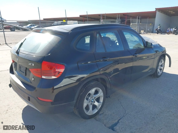 2015 BMW X1 sDrive28i with VIN WBAVM1C58FV498559, listed as a IAAI auction lot 41208638 with 100,452 mi miles. Bid and sale history available at carsss.com. Image 4.